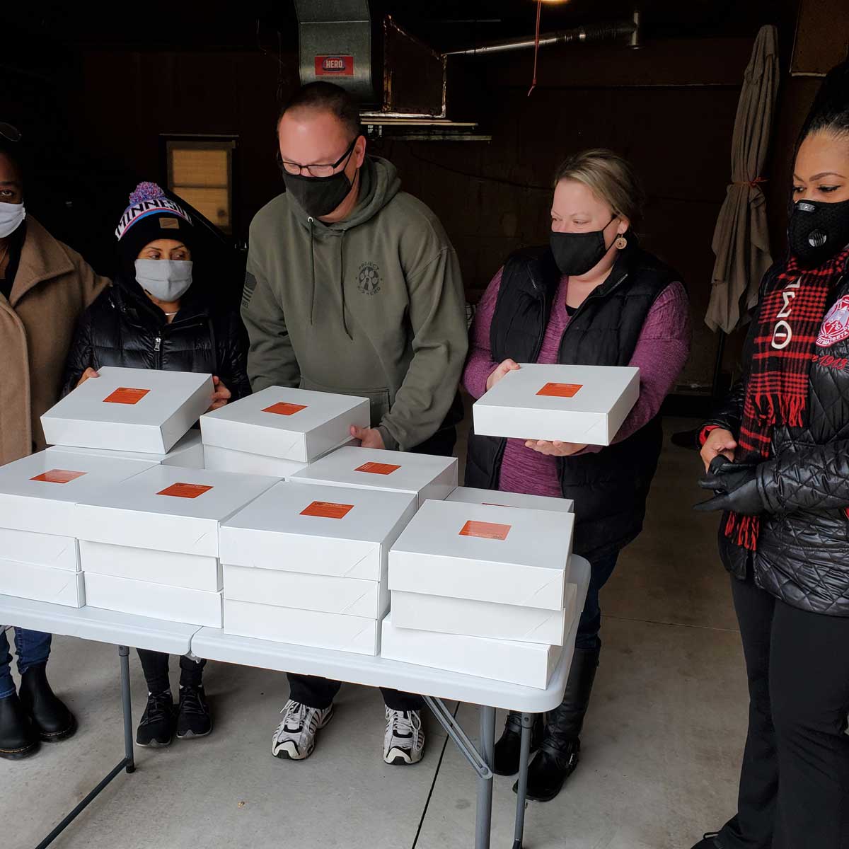 Volunteers handing out sweet potato pies 