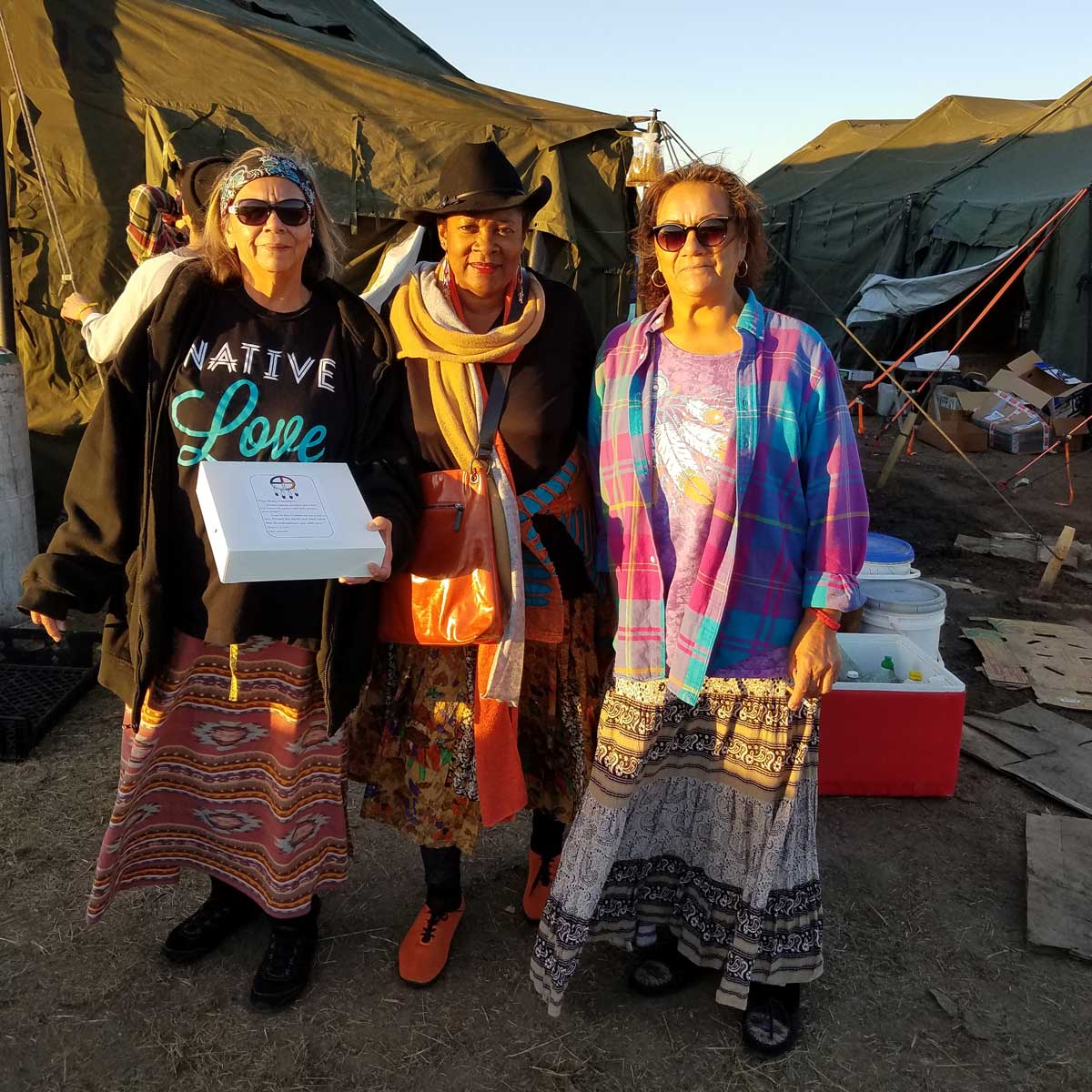 Rose standing with some women at Standing Rock