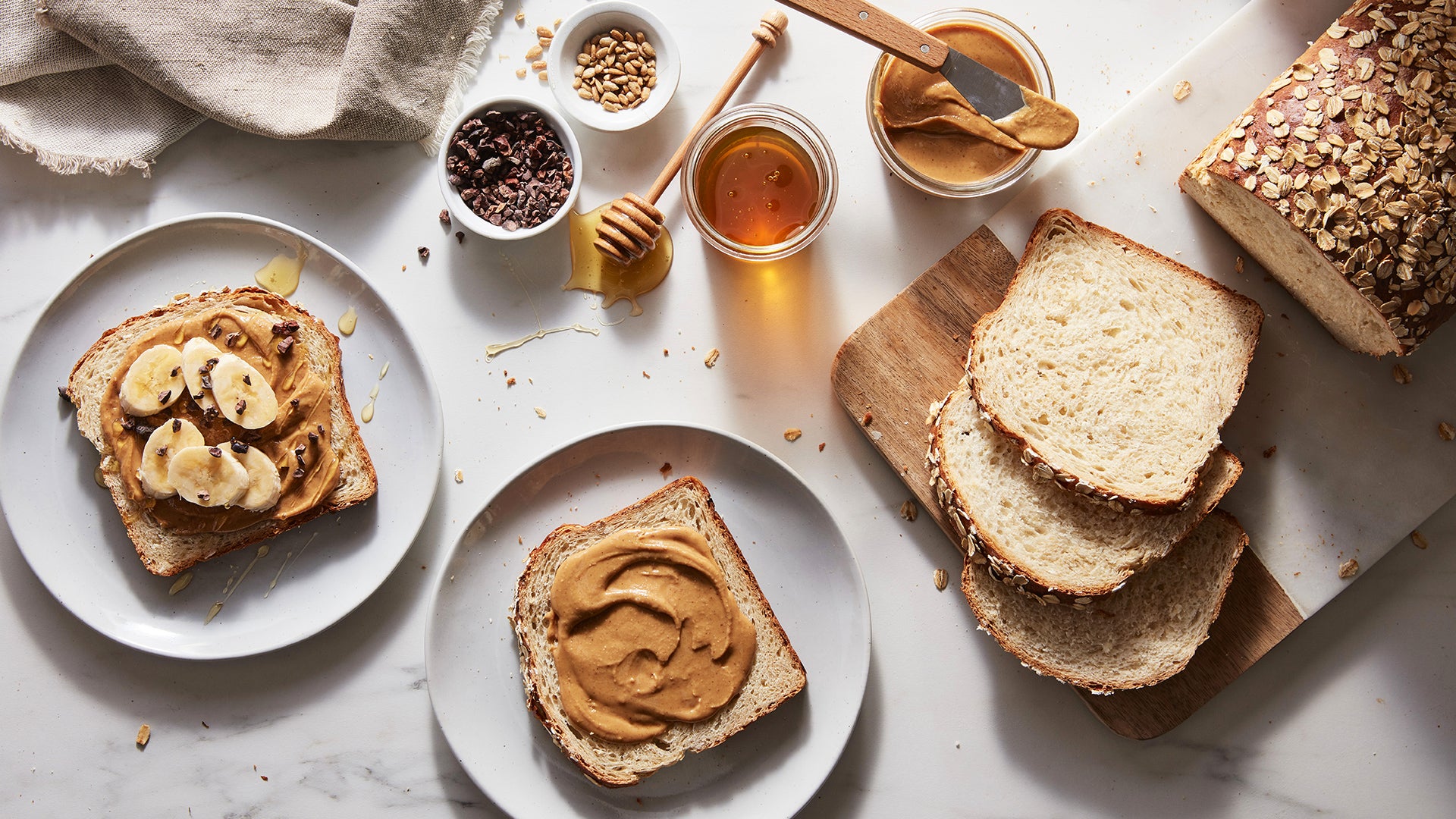 Oatmeal bread with peanut butter on a table