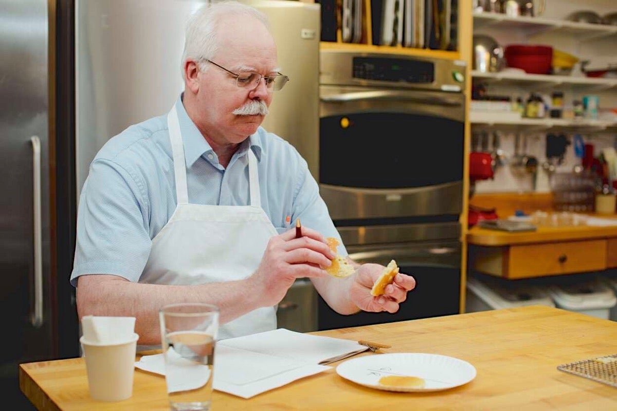 Frank tasting pancakes and taking notes