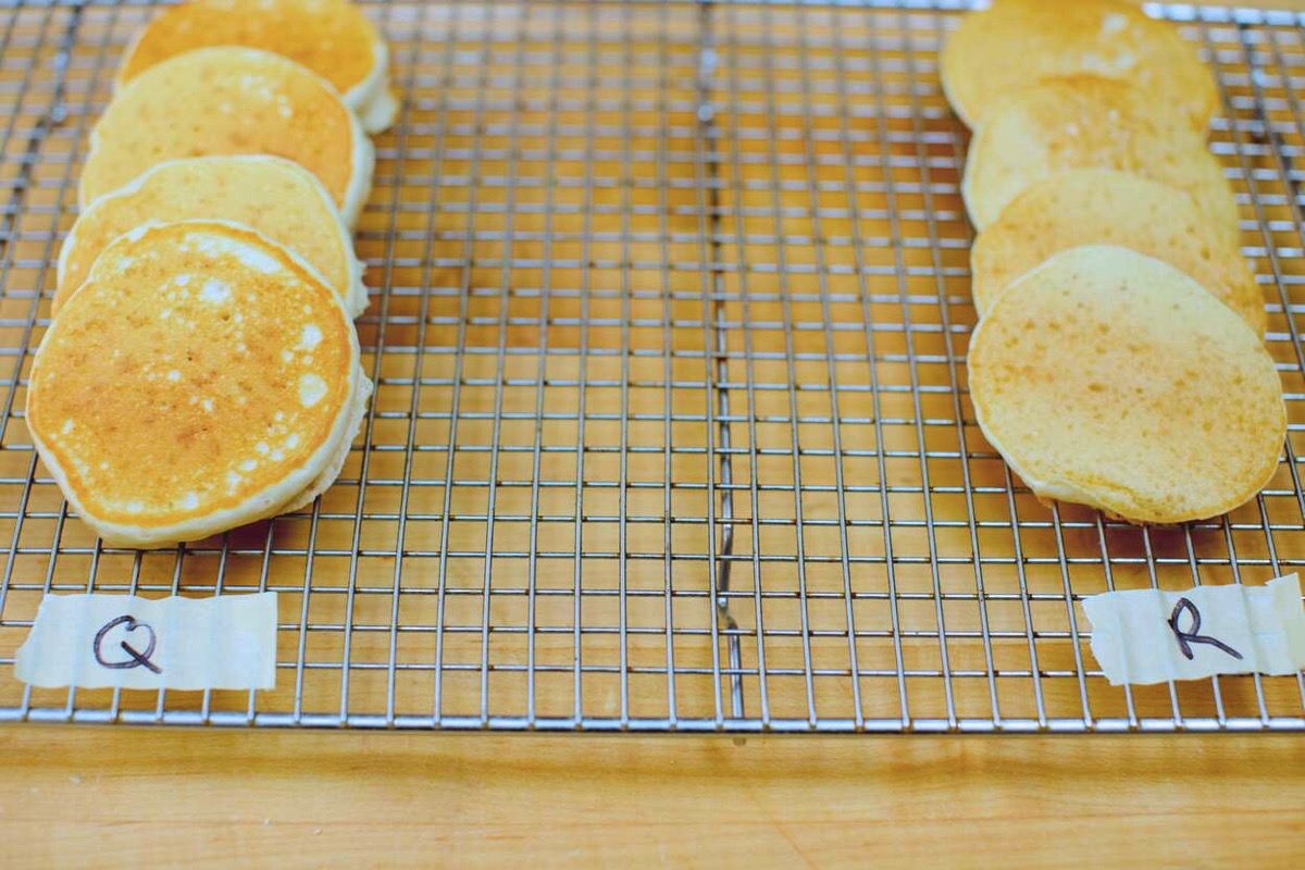 pancakes made from two different formulations side by side on a cooling rack.