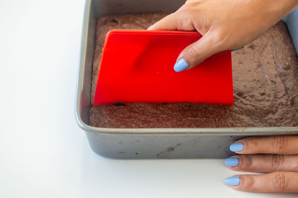 Cutting brownies with dough scraper