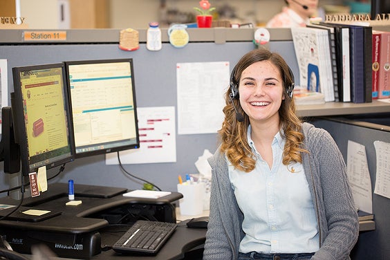 A happy employee-owner in customer service