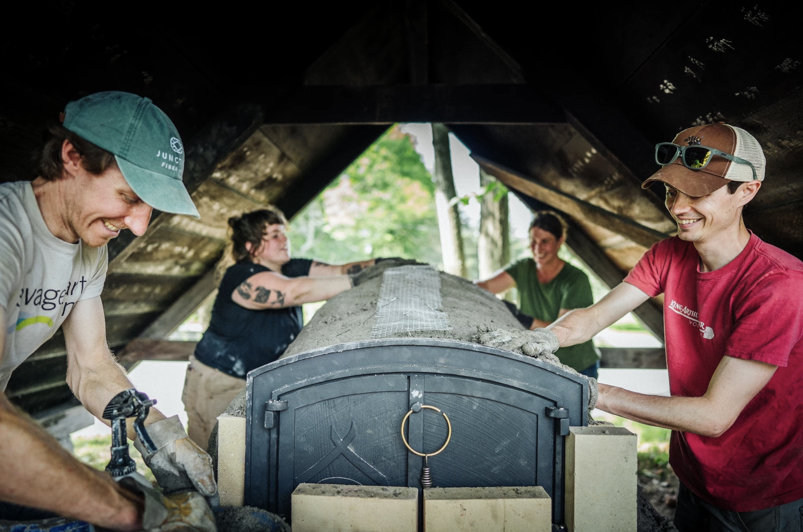 King Arthur volunteers building mud oven