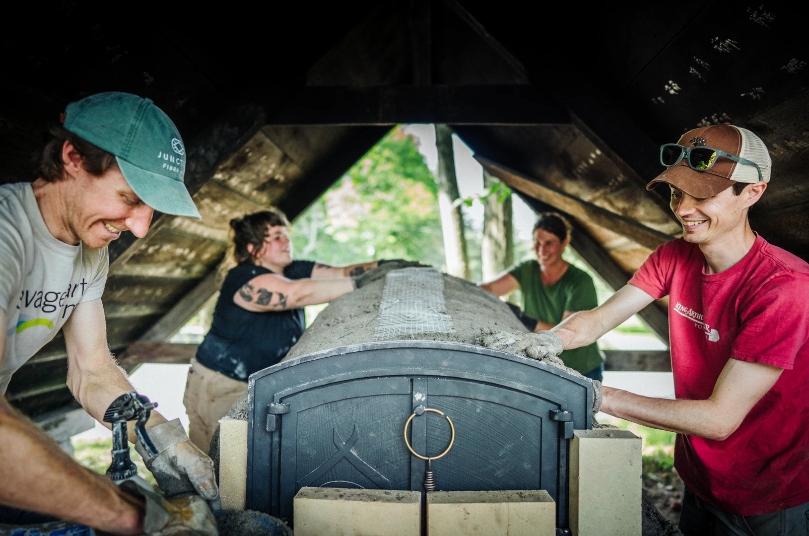 King Arthur volunteers building mud oven