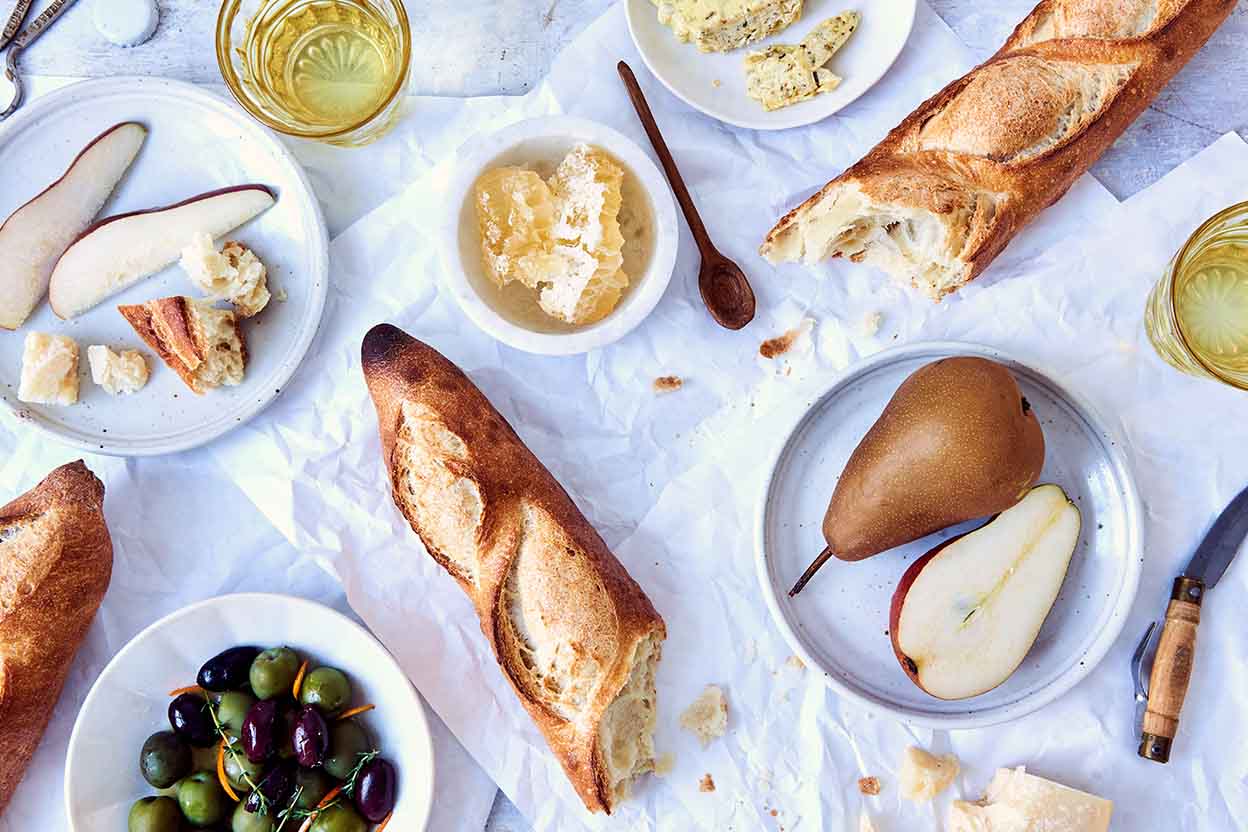 Baguette, European style bread on black wood table in morning time