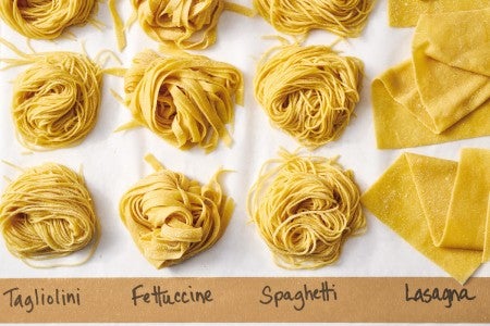 Four different types of fresh pasta noodles next to each other