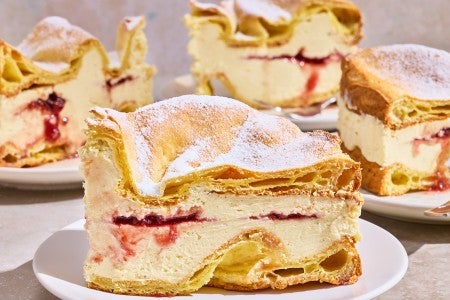 Karpatka Cake on plates showing the layers of cake and filling.