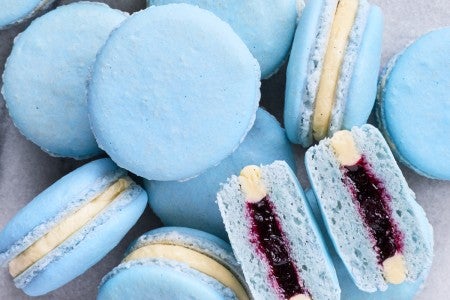 Pile of macarons with one split in half