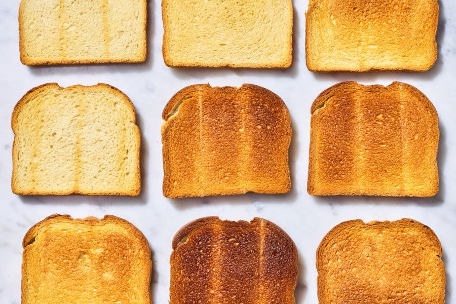 Slices of toast next to each other, each a different color of bake 