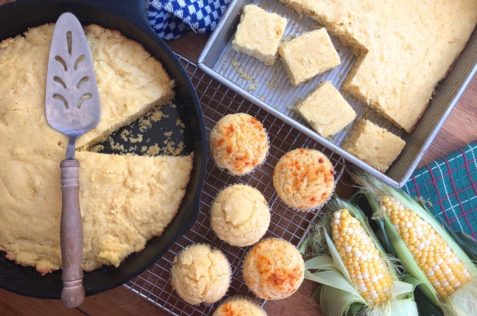 Skillet cornbread, corn muffins, and cornbread in a pan, on a table and ready to serve