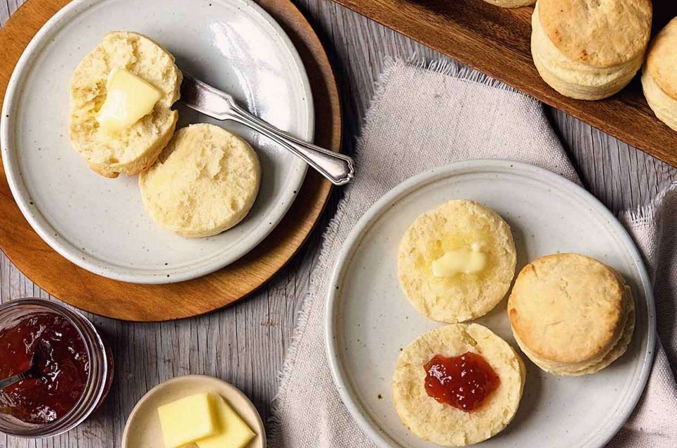 Plated biscuits with butter and jam