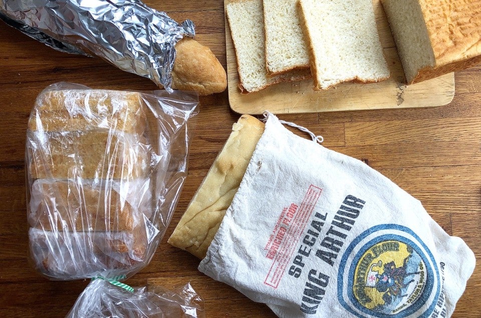 Bread in cloth, plastic, and foil wrappings