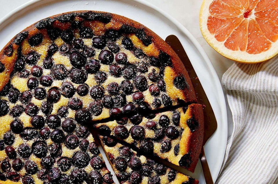 Plate with sliced blueberry breakfast cake