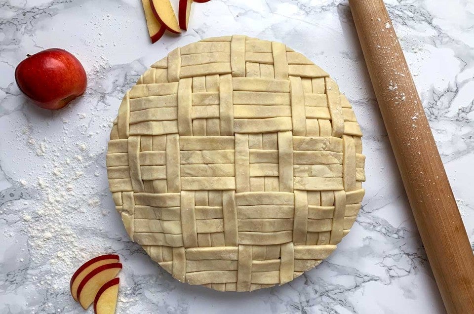 Unbaked apple pie with quilt design