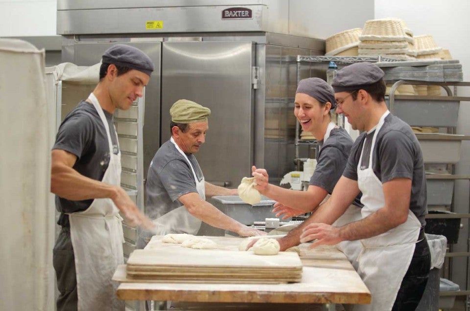 Bakers working together in the kitchen