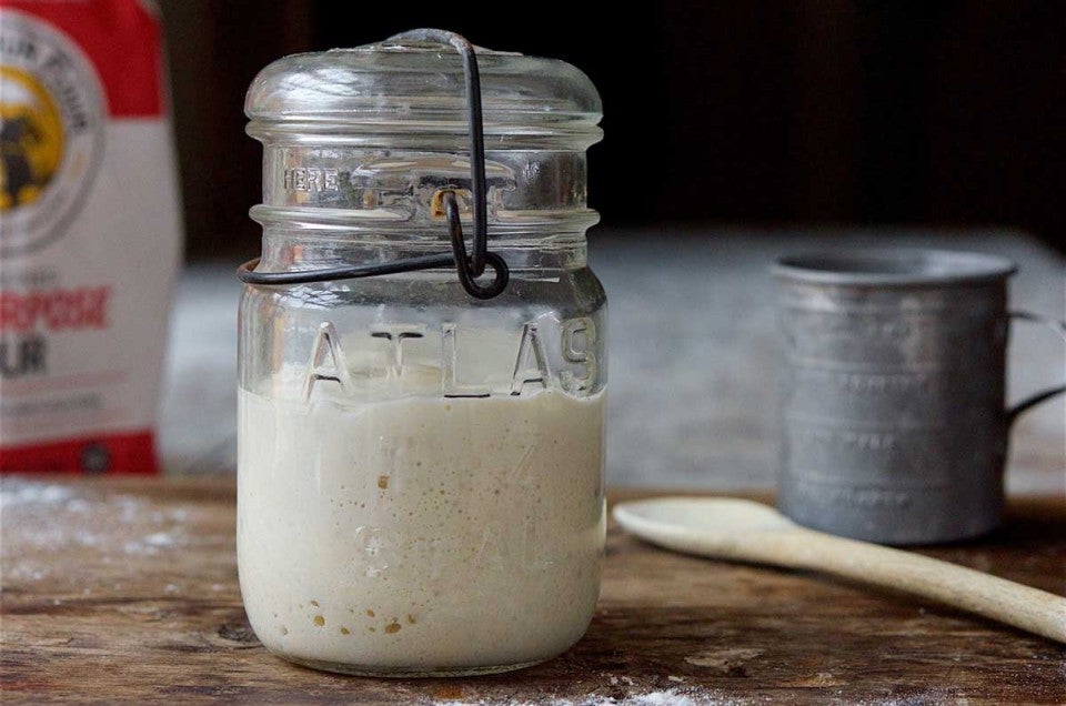 Jar of sourdough starter on counter