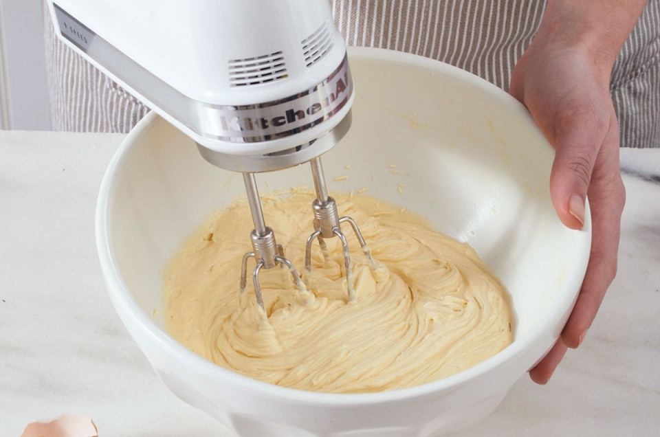 Electric beater mixing cake batter