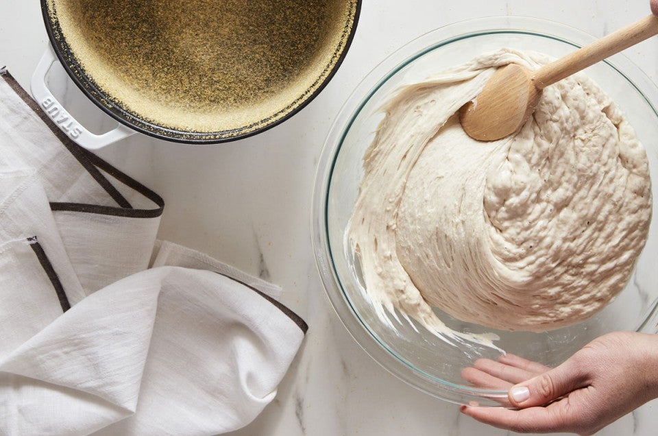 Wet bread dough being stirred