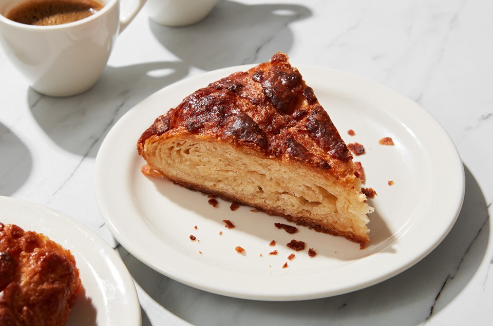 A plate with a slice of kouign-amann served - select to zoom