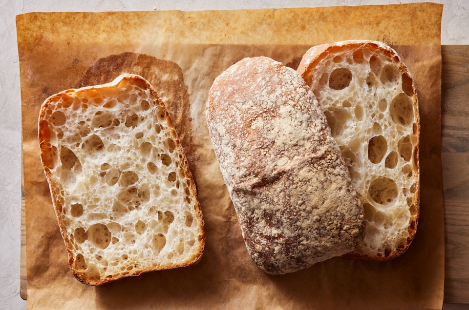 A few loaves of Pan de Cristal showing their open crumb