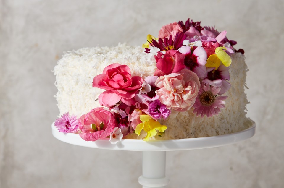Coconut cake decorated with pink flowers