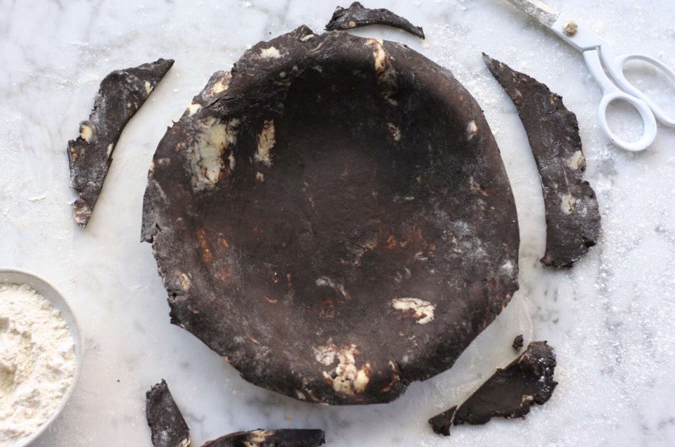 Chocolate pie dough rolled out and laid into a pie pan