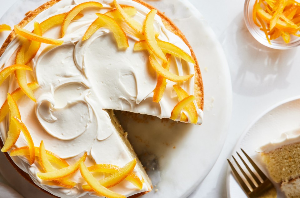 A layer cake garnished with candied oranges and a cream filling - select to zoom