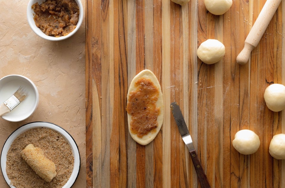 Seniorita bread dough that is spread with bread crumbs and ready to be rolled up - select to zoom