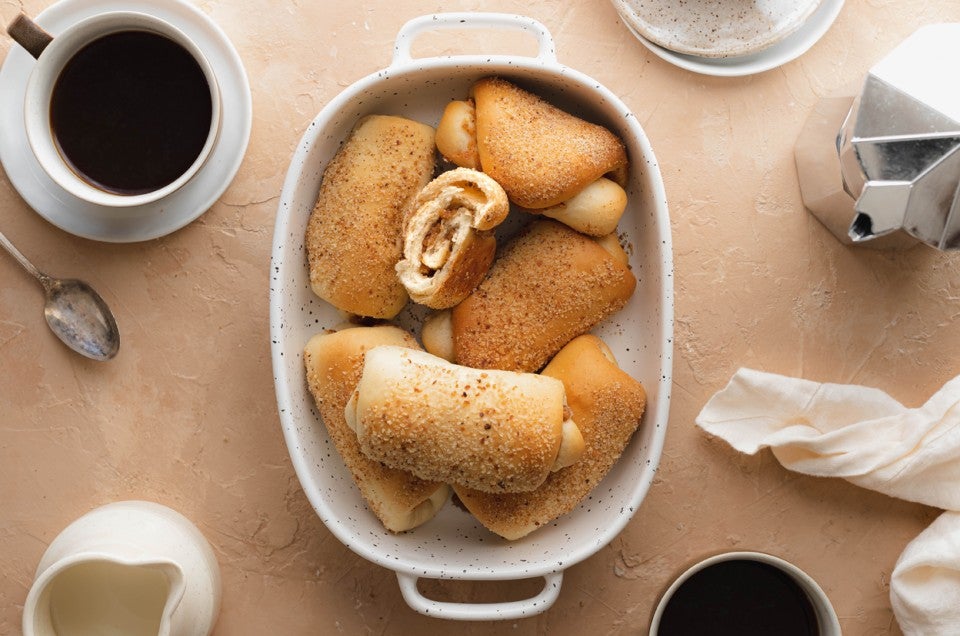 A dish full of senorita bread showing the swirled filling inside - select to zoom