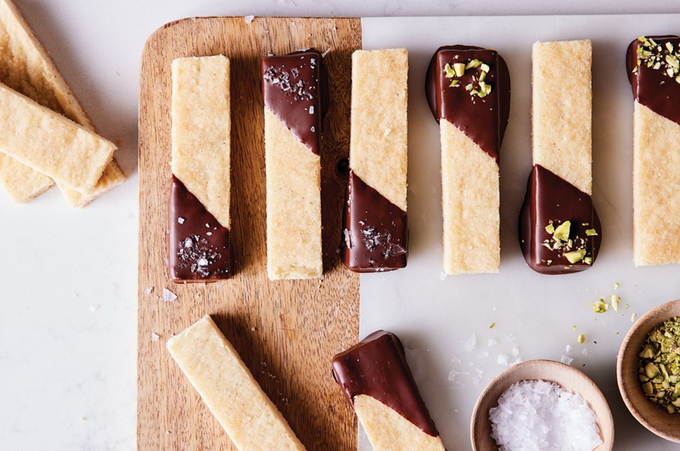 Bars of shortbread dipped in tempered chocolate and sprinkled with salt and pistachios - select to zoom