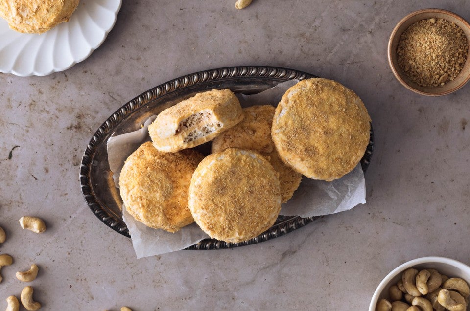 A stack of Filipino cookies, made with buttercream sandwiched between two cashew-meringue wafers coated with cookie crumbs - select to zoom