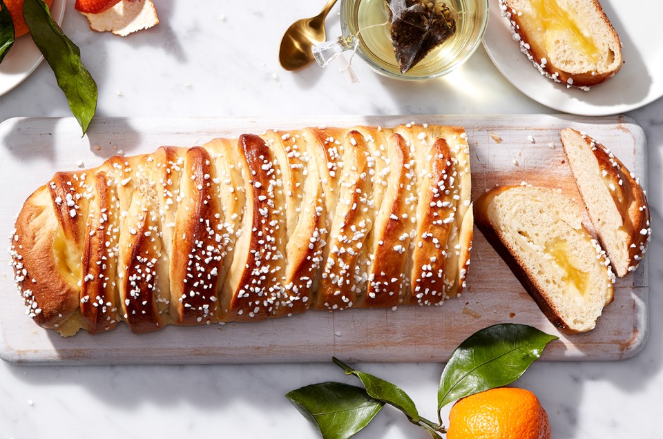 A loaf of braided bread filled with lemon curd and cut into slices - select to zoom