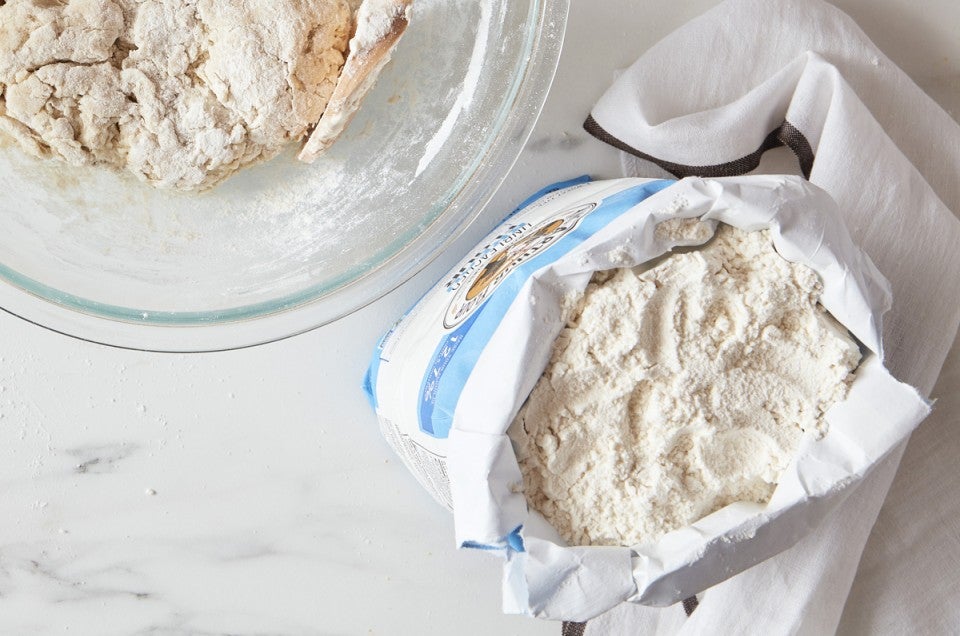 Top down view of open bag of bread flour