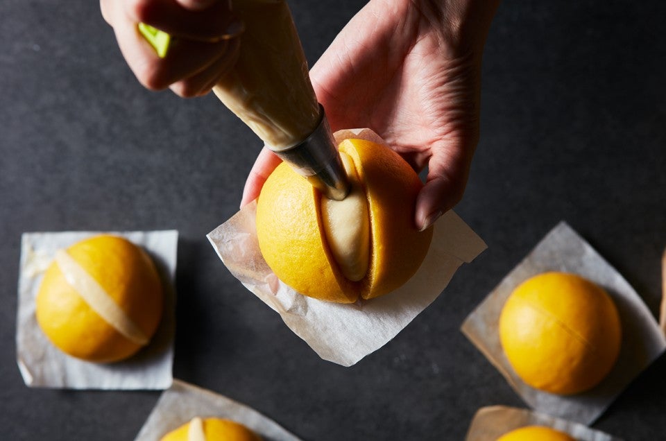 Steamed Carrot Bun being filled - select to zoom