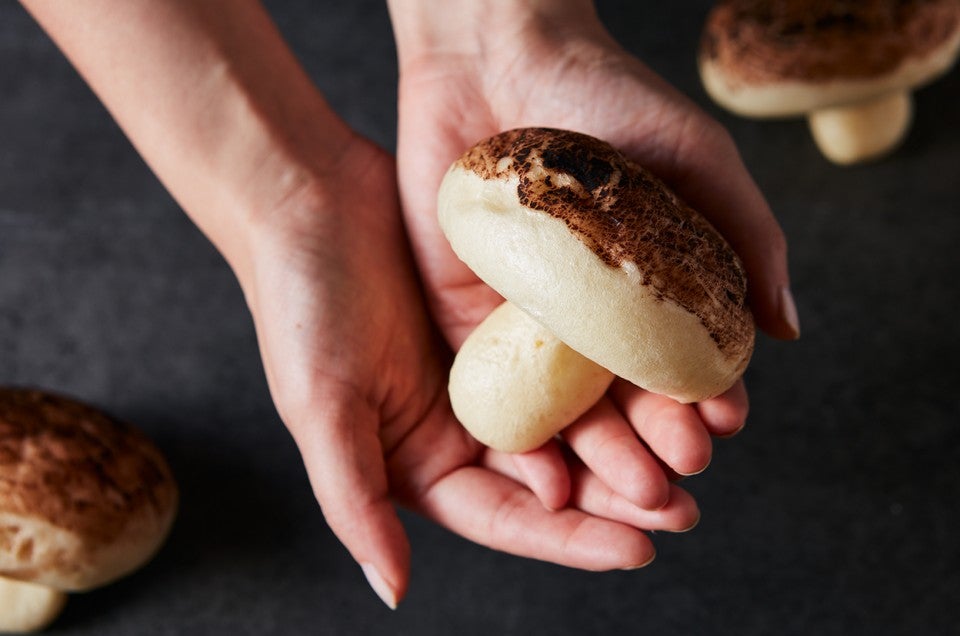 Chocolate Mushroom Bun in hands - select to zoom