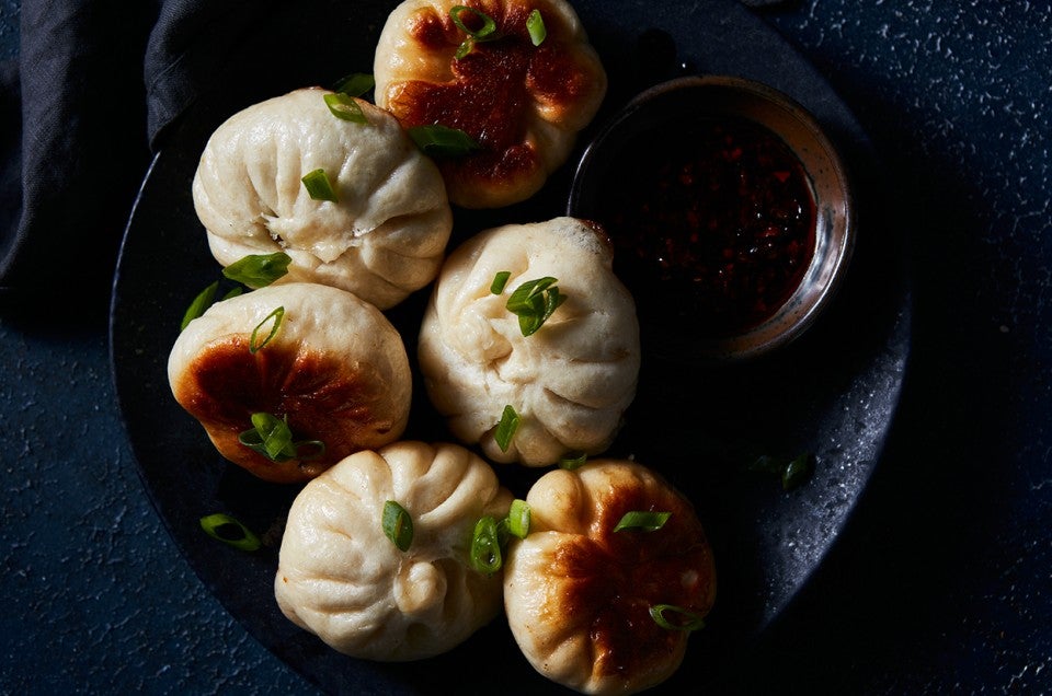 Mushroom and Cabbage Pan-Fried Buns unsauced, on plate - select to zoom