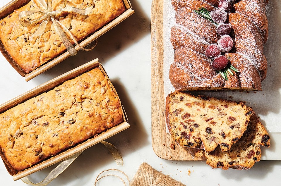 Sour Cream Fruitcake on cutting board and in paper baking pans - select to zoom