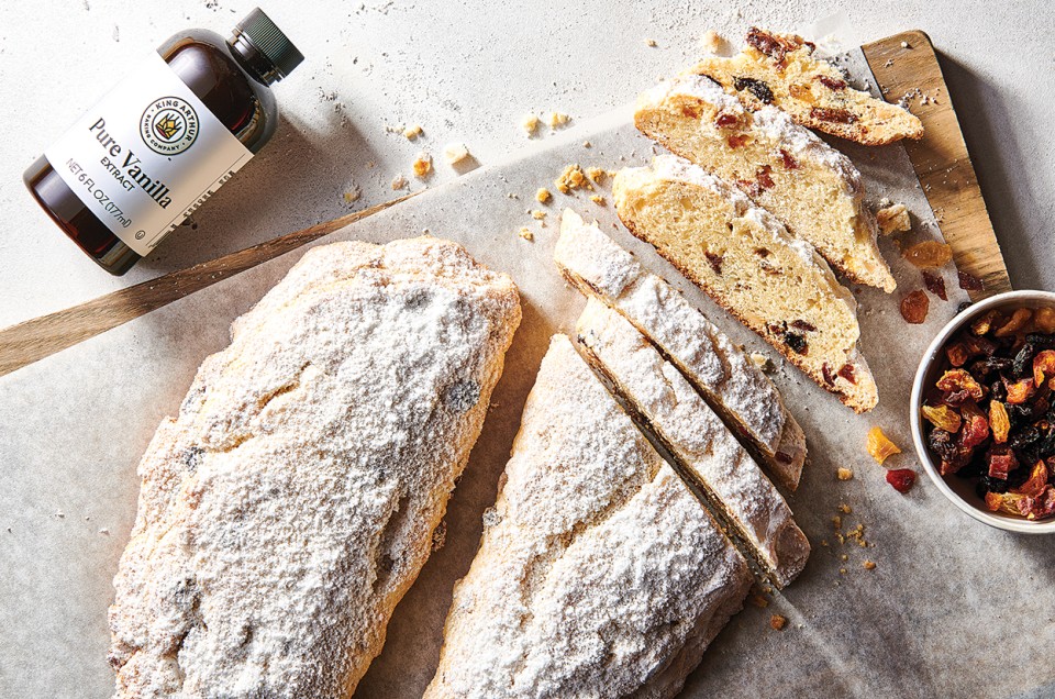 Our Easiest Stollen on a cutting board with dried fruit mix and vanilla extract - select to zoom