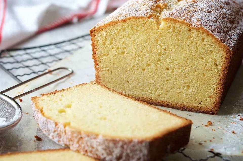 Velvet Pound Cake baked in a loaf pan and sliced to show its fine-textured interior.