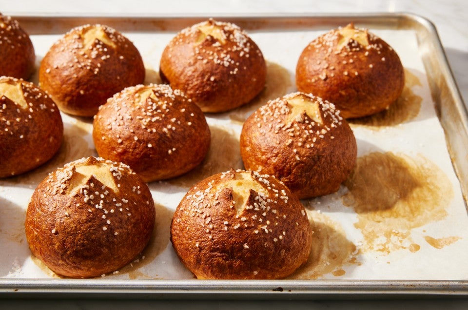 Baked Pretzel Buns on baking sheet