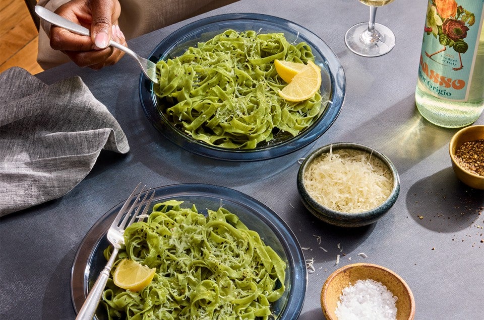 Fresh Herb Pasta being served on two plates - select to zoom
