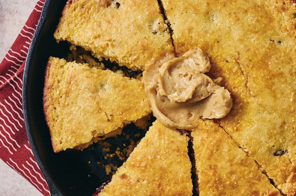 Cranberry Cornbread in a cast iron pan - select to zoom