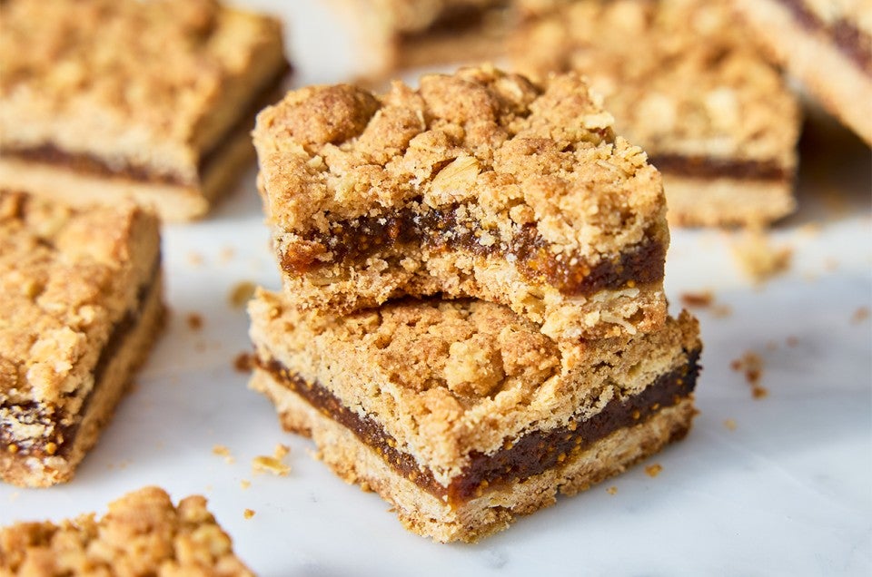 Brown Sugar and Oat Fig Bars stacked up - select to zoom