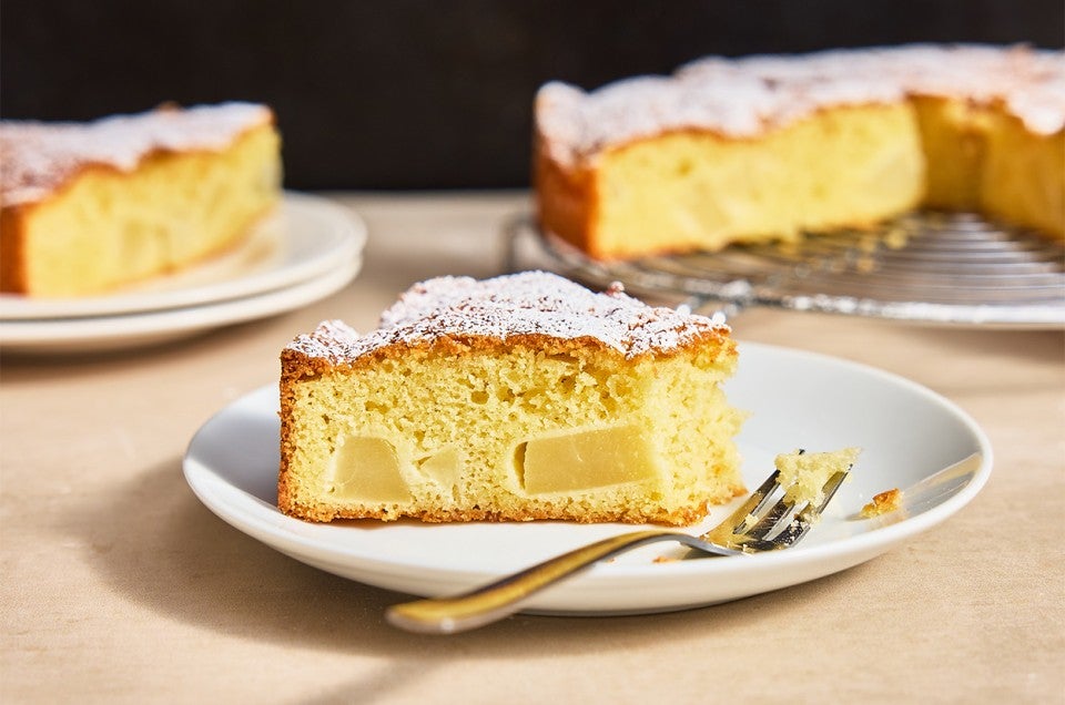 A slice of Pear and Almond Cake on a plate - select to zoom