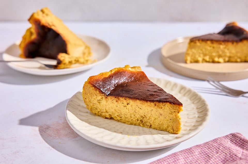 Three pieces of Pumpkin Basque Cheesecake on plates - select to zoom