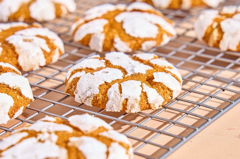 Pumpkin Crinkle Cookies on a cooling rack - select to zoom