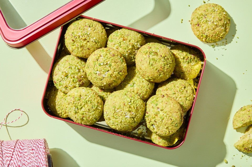 Sparkling Pistachio Cookies in a decorative tin for gifting - select to zoom