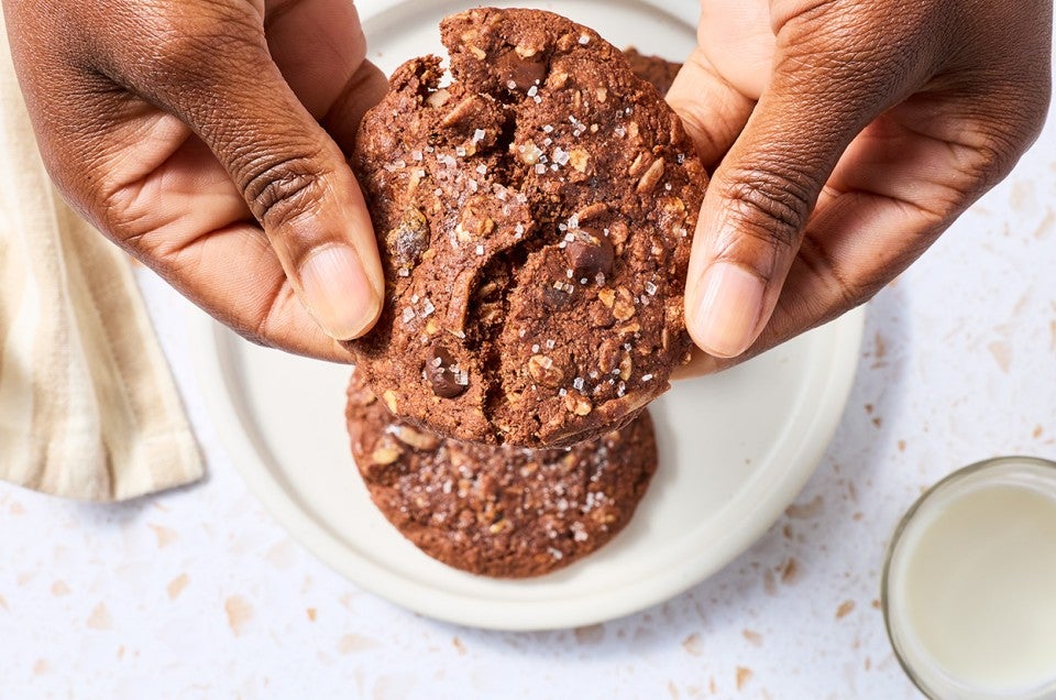 Breaking a Chocolate Lactation Cookie to show the soft texture. - select to zoom