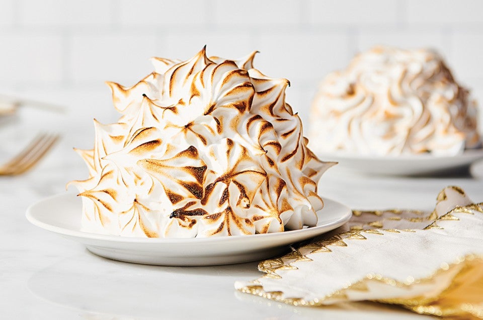 Swiss Meringue piped as a spiky and textured element on baked Alaska with browned edges. - select to zoom